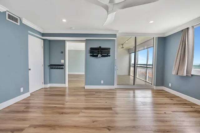 a balcony with furniture and a potted plant
