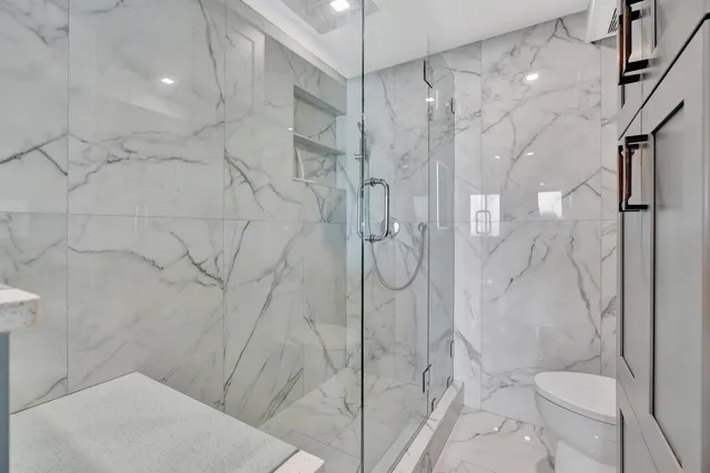 a view of a dining room with furniture and a book shelf