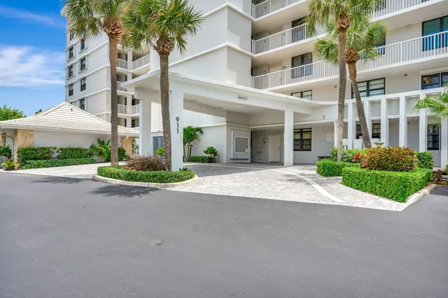 a view of a porch with furniture and garden
