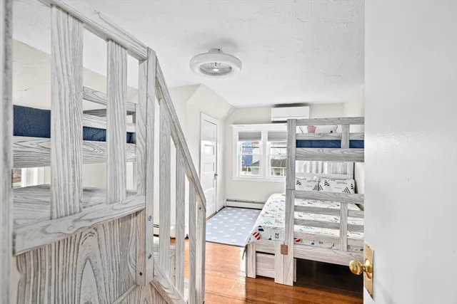 a view of a bedroom with furniture