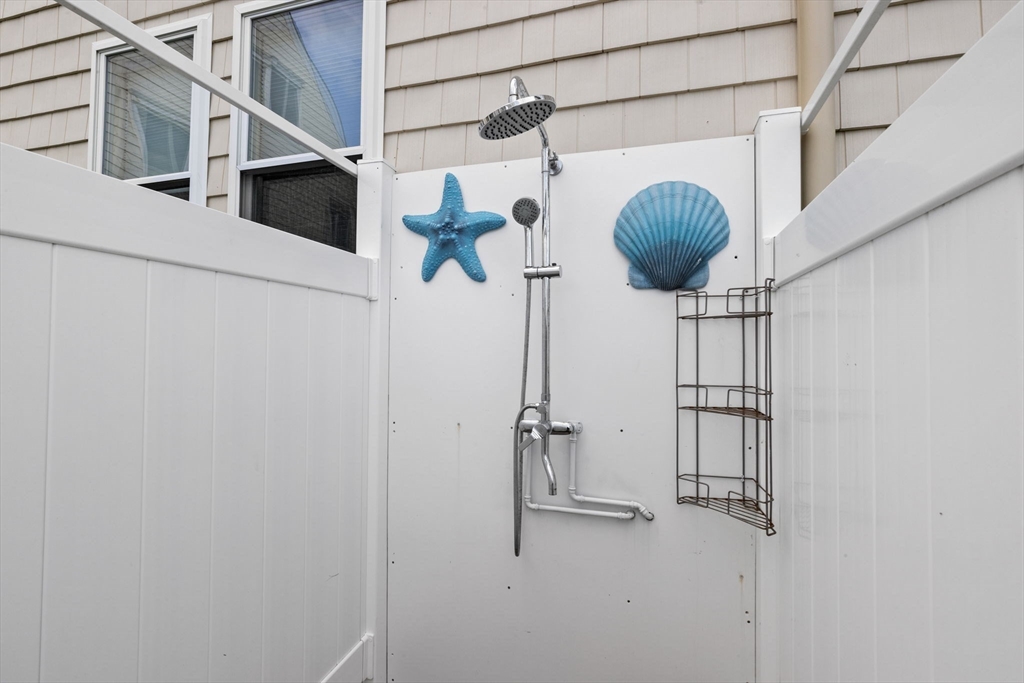 24 Warren Street Hull, MA 02045 - Photo 26 of 41 a view of a storage & utility room with wooden floor