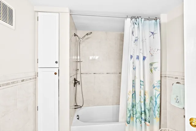 a bedroom with a bed a table and chairs