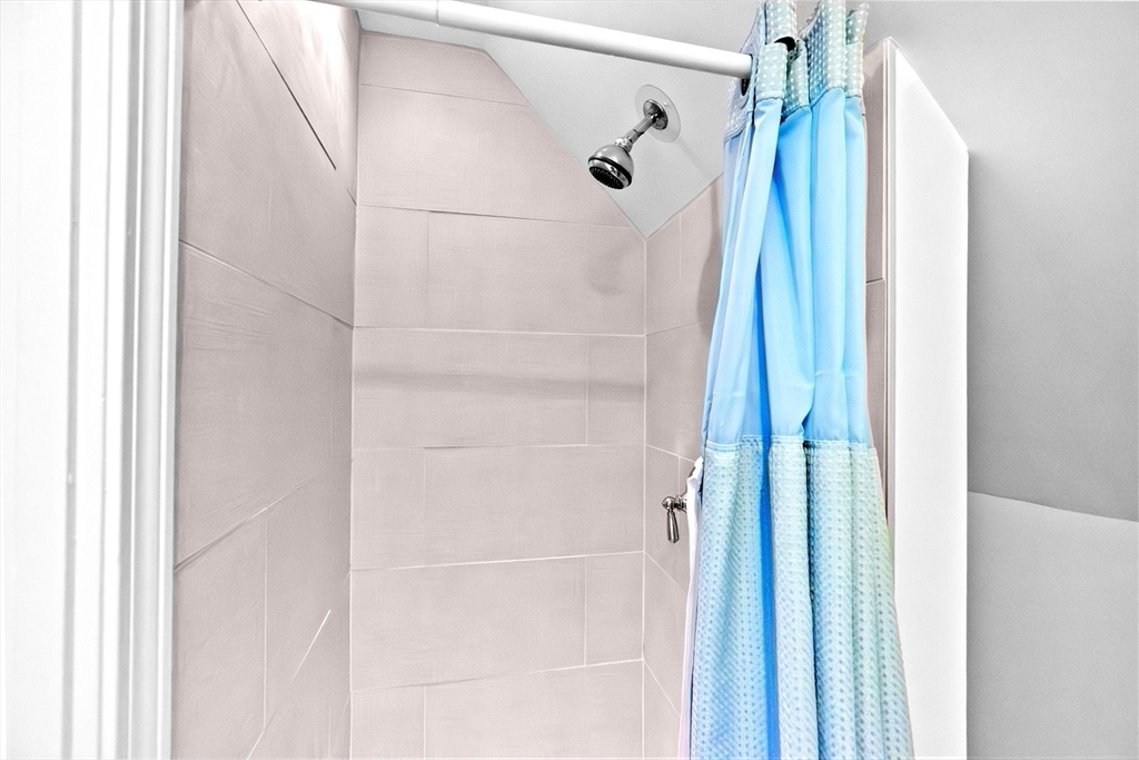 24 Warren Street Hull, MA 02045 - Photo 39 of 41 a bathroom with a shower