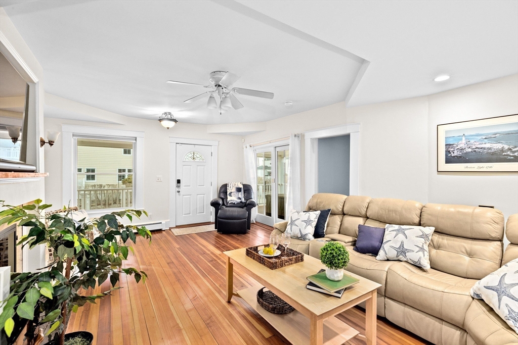 24 Warren Street Hull, MA 02045 - Photo 4 of 41 a living room with furniture and wooden floor