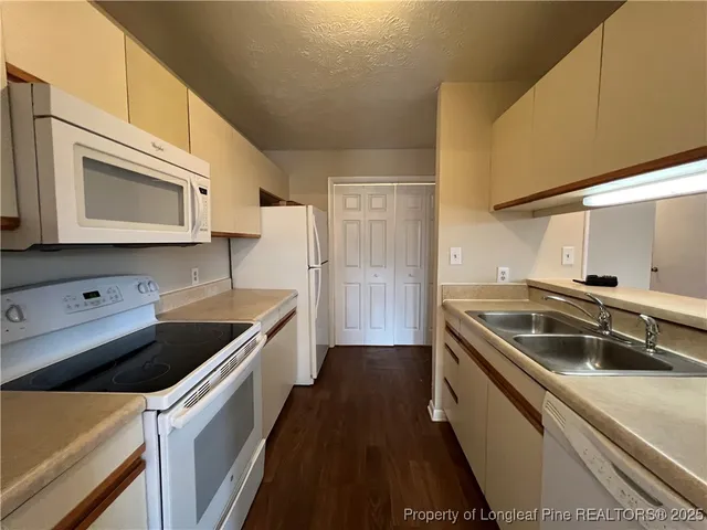 a view of a livingroom with a staircase