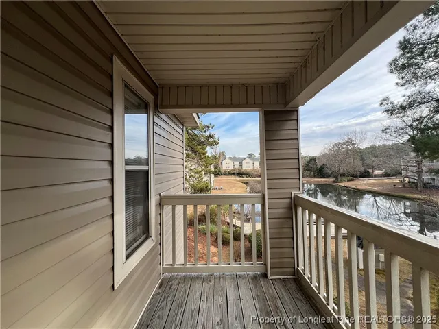 a balcony with wooden floor
