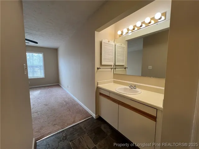 a bathroom with a toilet and a bathtub