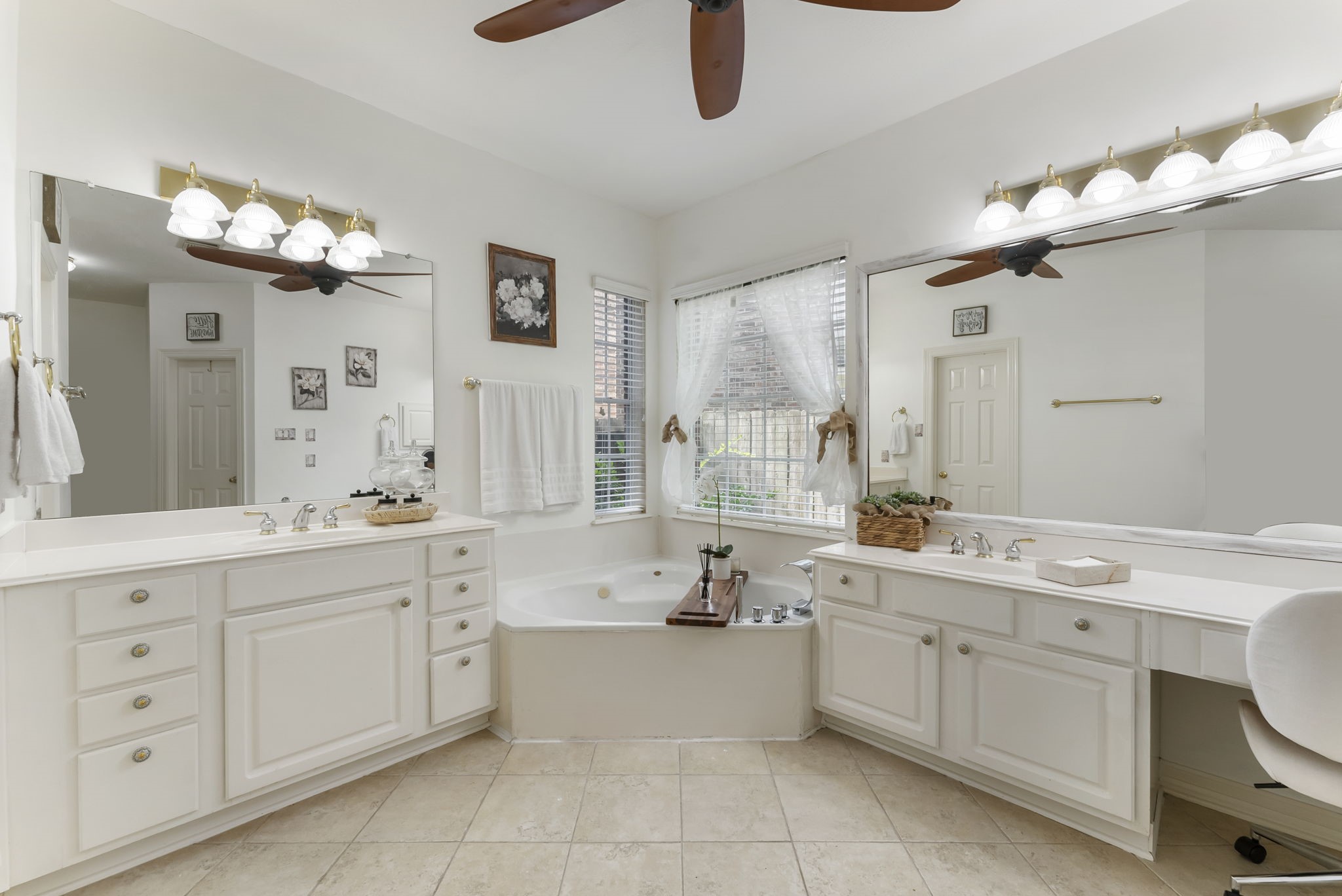 12907 Ryaneagles Circle Houston, TX 77044 - Photo 23 of 48 a bathroom with a double vanity sink a mirror a bathtub and shower