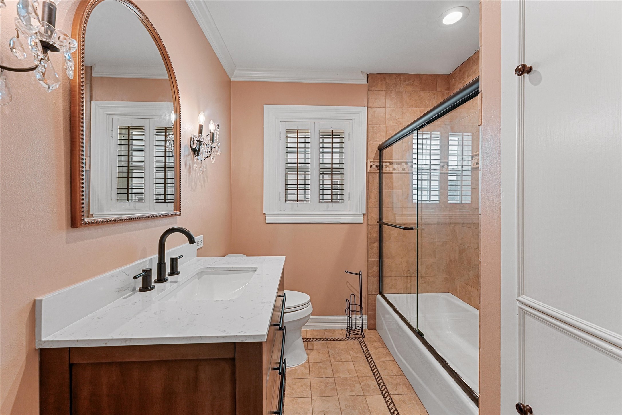6645 Fairfield Street Houston, TX 77023 - Photo 14 of 28 a bathroom with a sink a toilet a mirror and shower