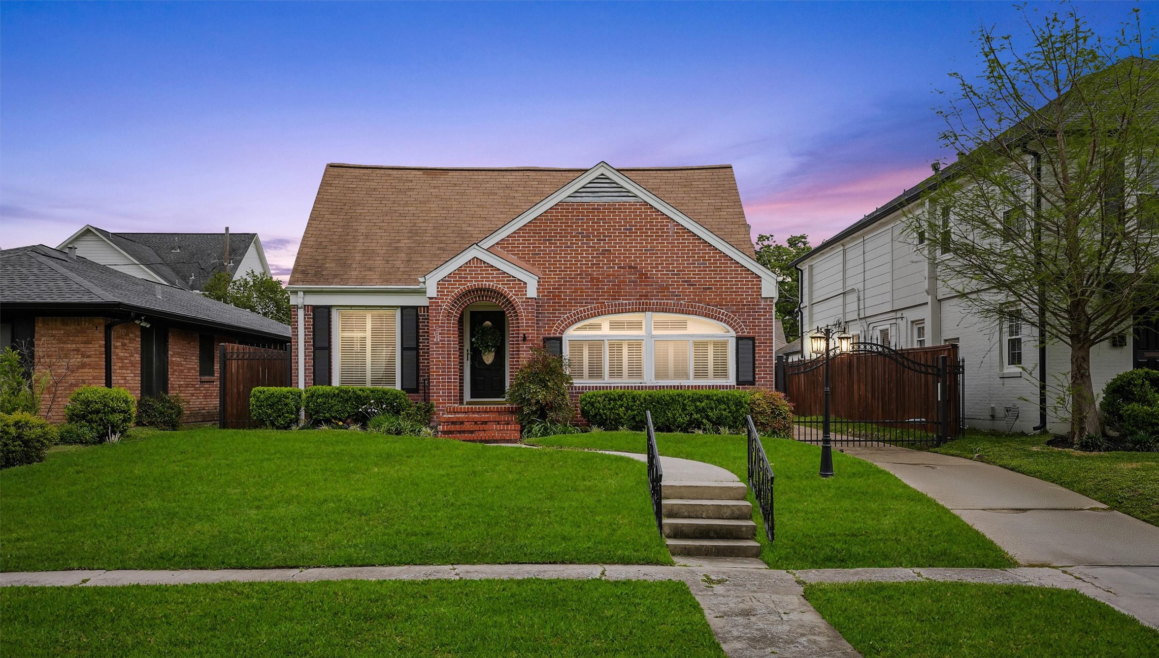 6645 Fairfield Street Houston, TX 77023 - Photo 2 of 28 a front view of a house with a yard and potted plants