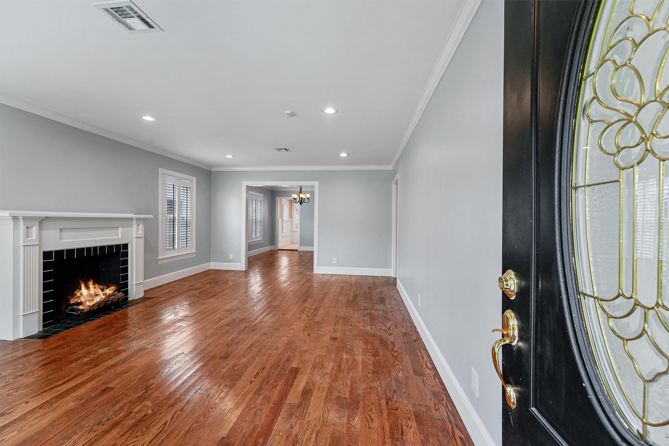 6645 Fairfield Street Houston, TX 77023 - Photo 4 of 28 a view of a livingroom with wooden floor and a fireplace