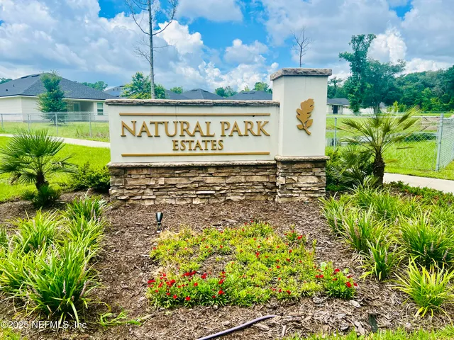 a kitchen with stainless steel appliances kitchen island granite countertop a refrigerator and a sink