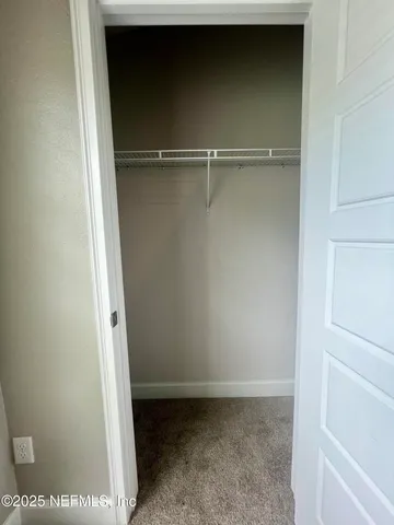 a view of a room with racks on the wall