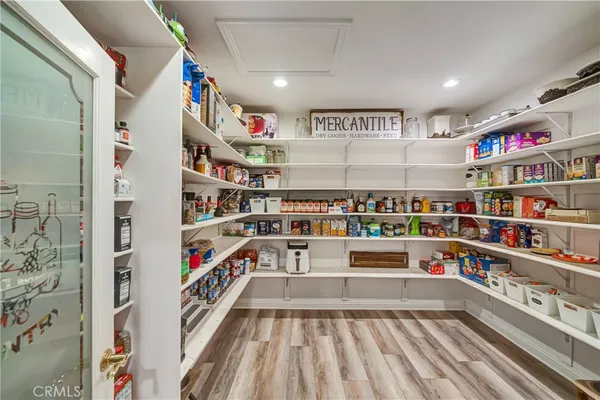 a spacious bathroom with a granite countertop sink mirror and a