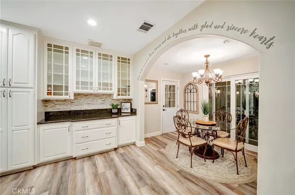 a bathroom with a tub shower and sink