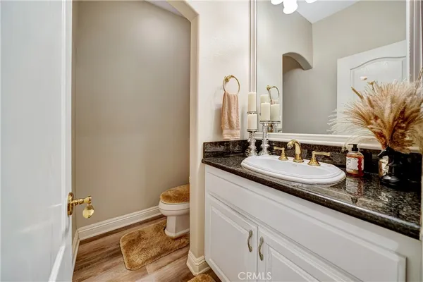 a spacious bathroom with a double vanity sink and a mirror