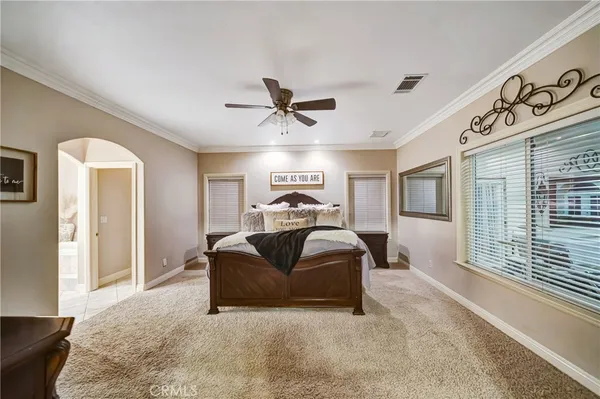 a spacious bathroom with a double vanity sink mirror and toilet