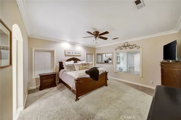 a bedroom with a bed and a view of bathroom