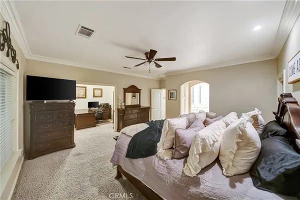 a kitchen with granite countertop a sink a stove and cabinets