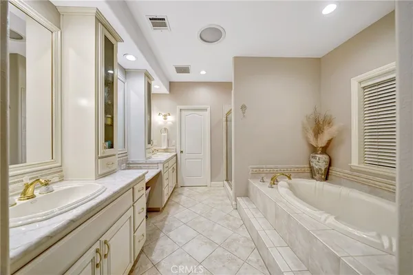 a bed room with a bed and a chandelier