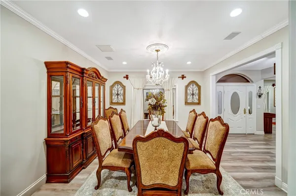 a kitchen with stainless steel appliances kitchen island granite countertop a refrigerator and a stove top oven