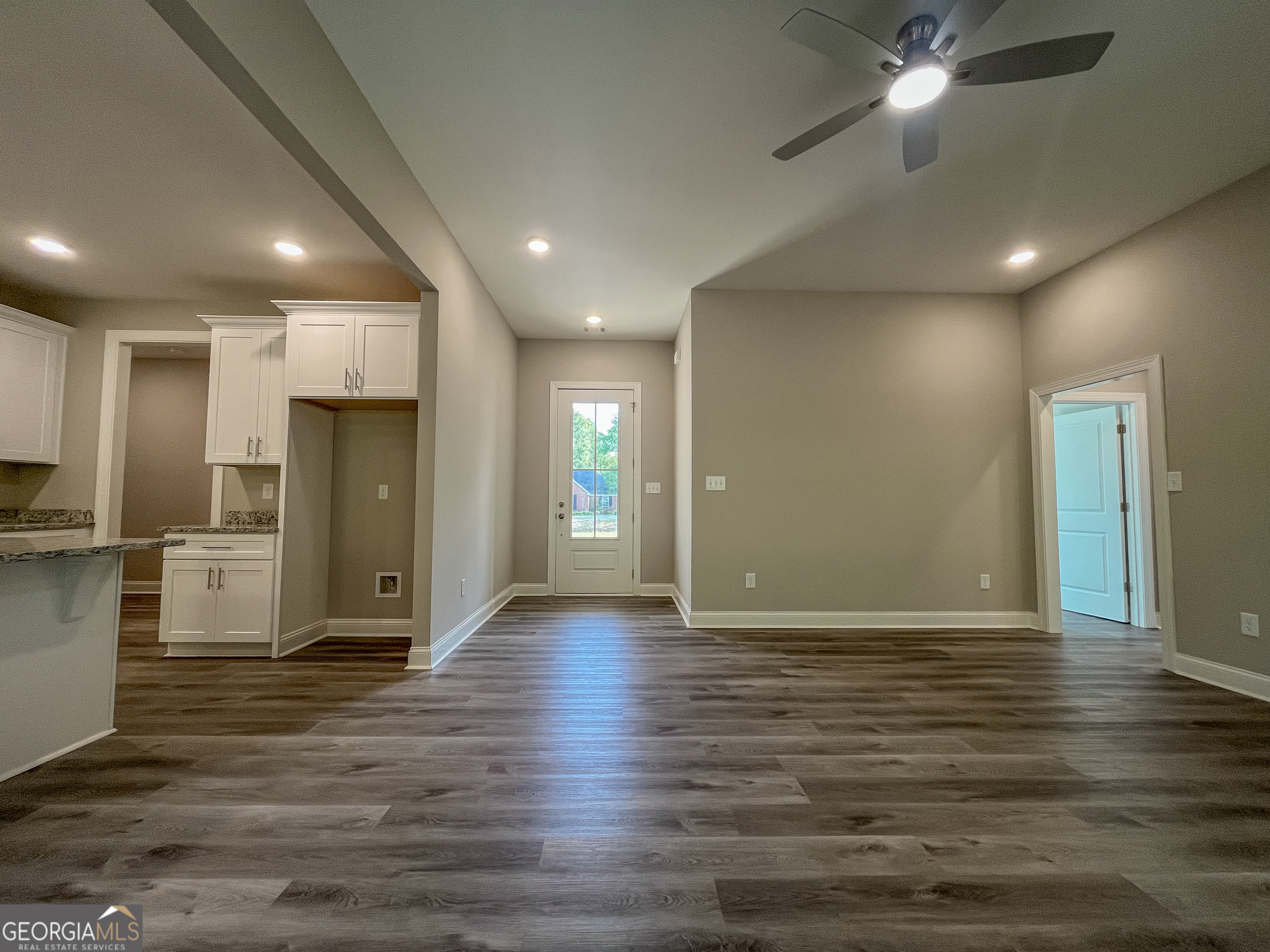 711 Flanders Lane Dublin, GA 31021 - Photo 8 of 49 a view of an empty room with wooden floor