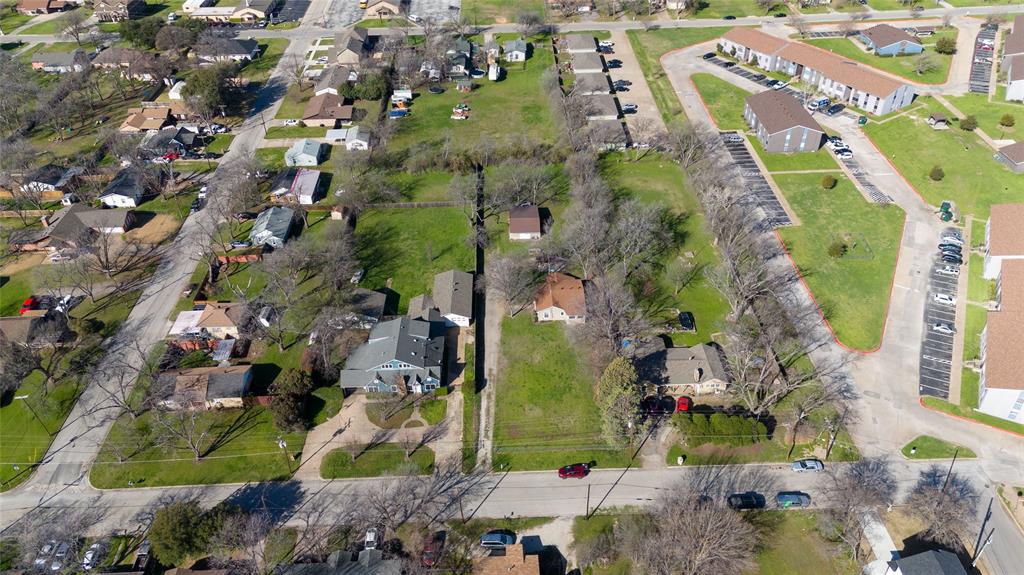 313 North Roe Street White Settlement, TX 76108 - Photo 32 of 33 Expansive land parcels featuring mature trees and established residential structures
