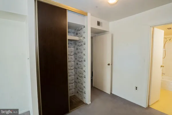 a view of hallway with closet