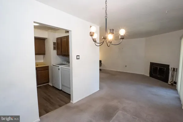 a view of a kitchen with a sink fire place
