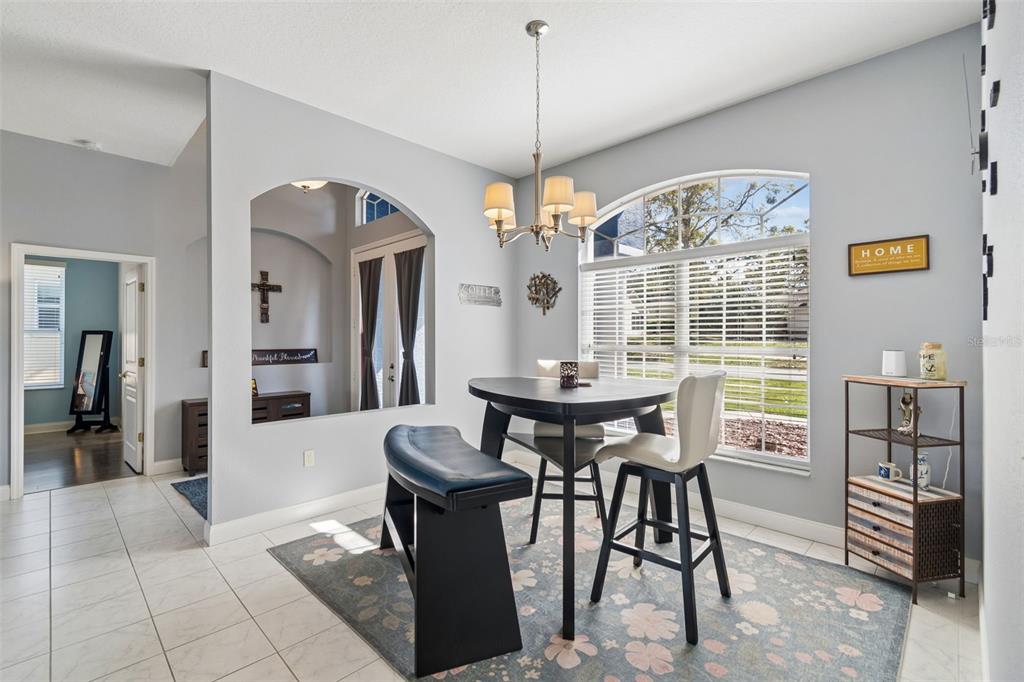 11017 Audie Brook Drive Spring Hill, FL 34608 - Photo 12 of 67 a view of a dining room with furniture and window