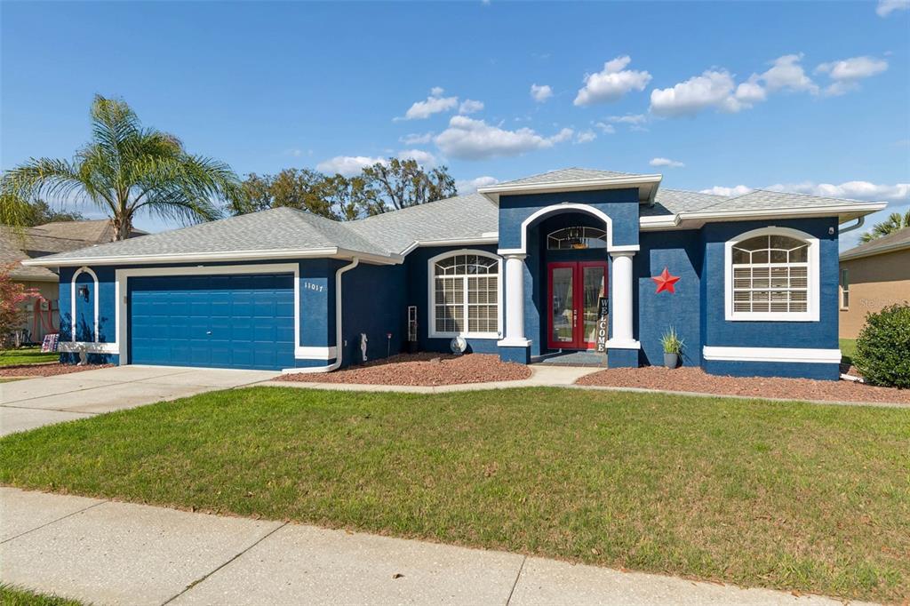 11017 Audie Brook Drive Spring Hill, FL 34608 - Photo 2 of 67 a front view of a house with a yard