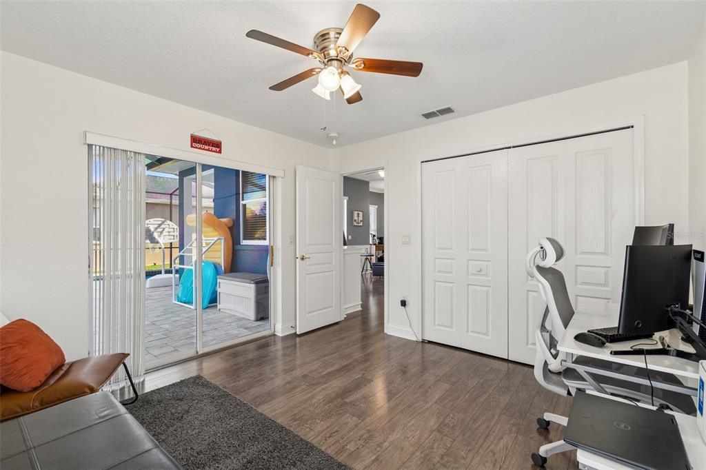11017 Audie Brook Drive Spring Hill, FL 34608 - Photo 39 of 67 a view of workspace with wooden floor and ceiling fan