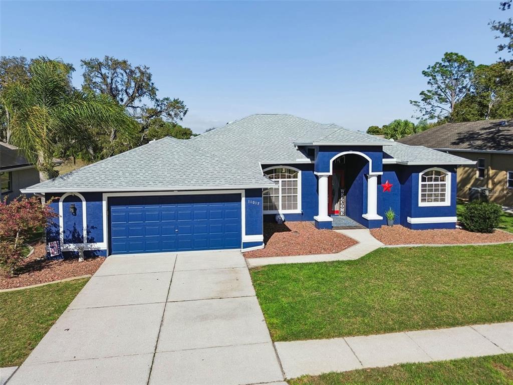 11017 Audie Brook Drive Spring Hill, FL 34608 - Photo 4 of 67 a front view of house with yard and green space