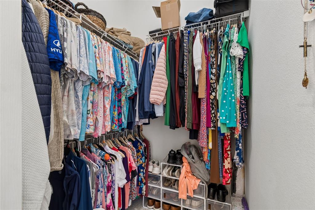 11017 Audie Brook Drive Spring Hill, FL 34608 - Photo 43 of 67 a view of walk in closet with clothes