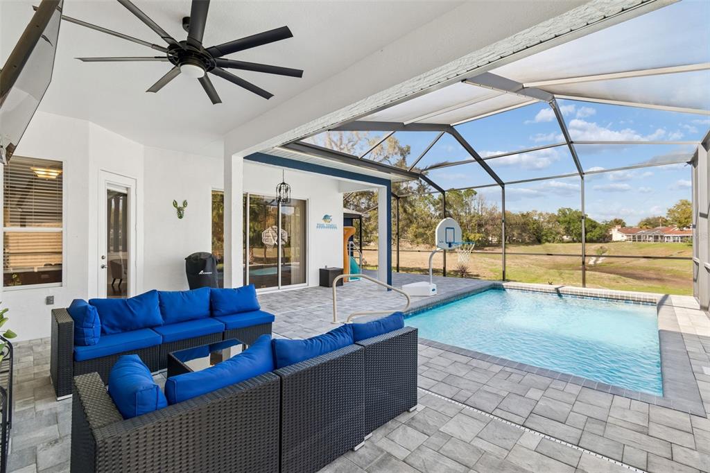 11017 Audie Brook Drive Spring Hill, FL 34608 - Photo 50 of 67 a living room with couch and a ceiling fan