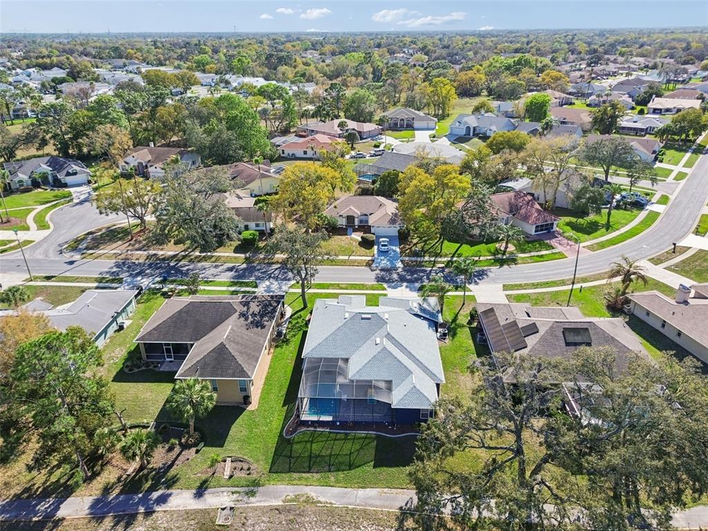 11017 Audie Brook Drive Spring Hill, FL 34608 - Photo 62 of 67 an aerial view of residential houses with outdoor space and parking