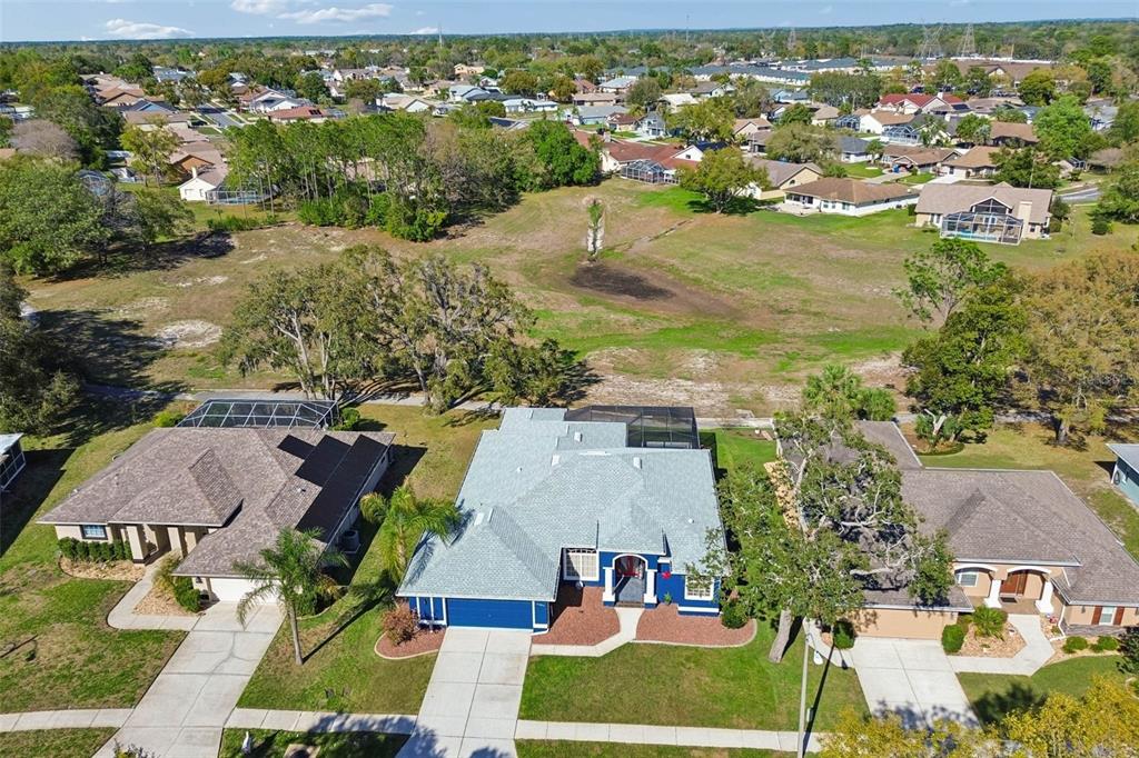 11017 Audie Brook Drive Spring Hill, FL 34608 - Photo 65 of 67 an aerial view of residential houses with outdoor space and river