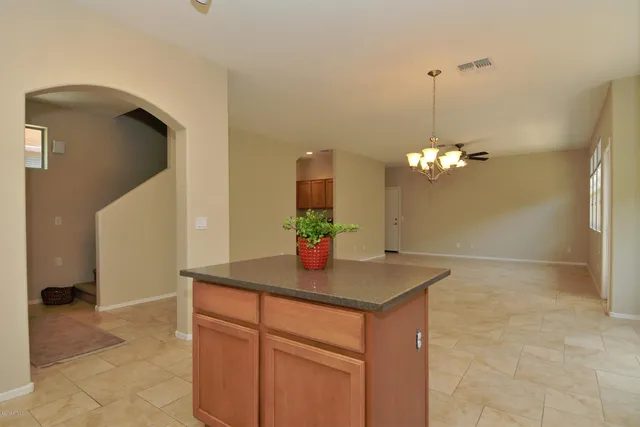 a kitchen with granite countertop cabinets and sink