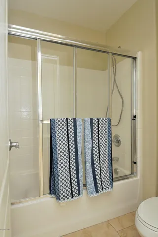 a view of a bathroom from a corridor