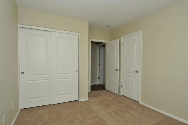 a front view of a house with garage