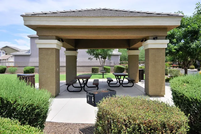 a childrens park with lots of swings and slides