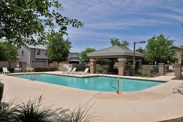 a view of a park with iron fence