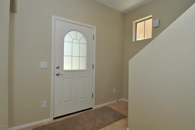 a view of an entryway with wooden floor