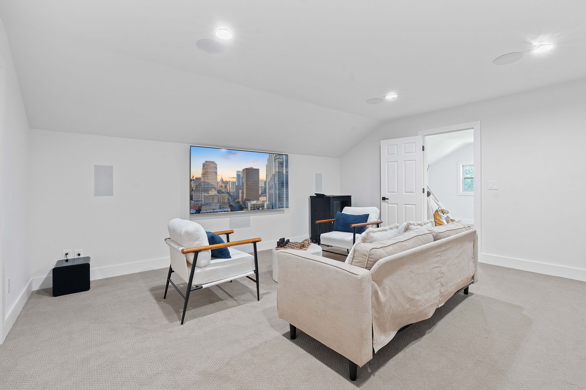 1325 Likeness Road Spicewood, TX 78669 - Photo 17 of 40 Living room featuring lofted ceiling, light colored carpet, recessed lighting, and a view of skyline