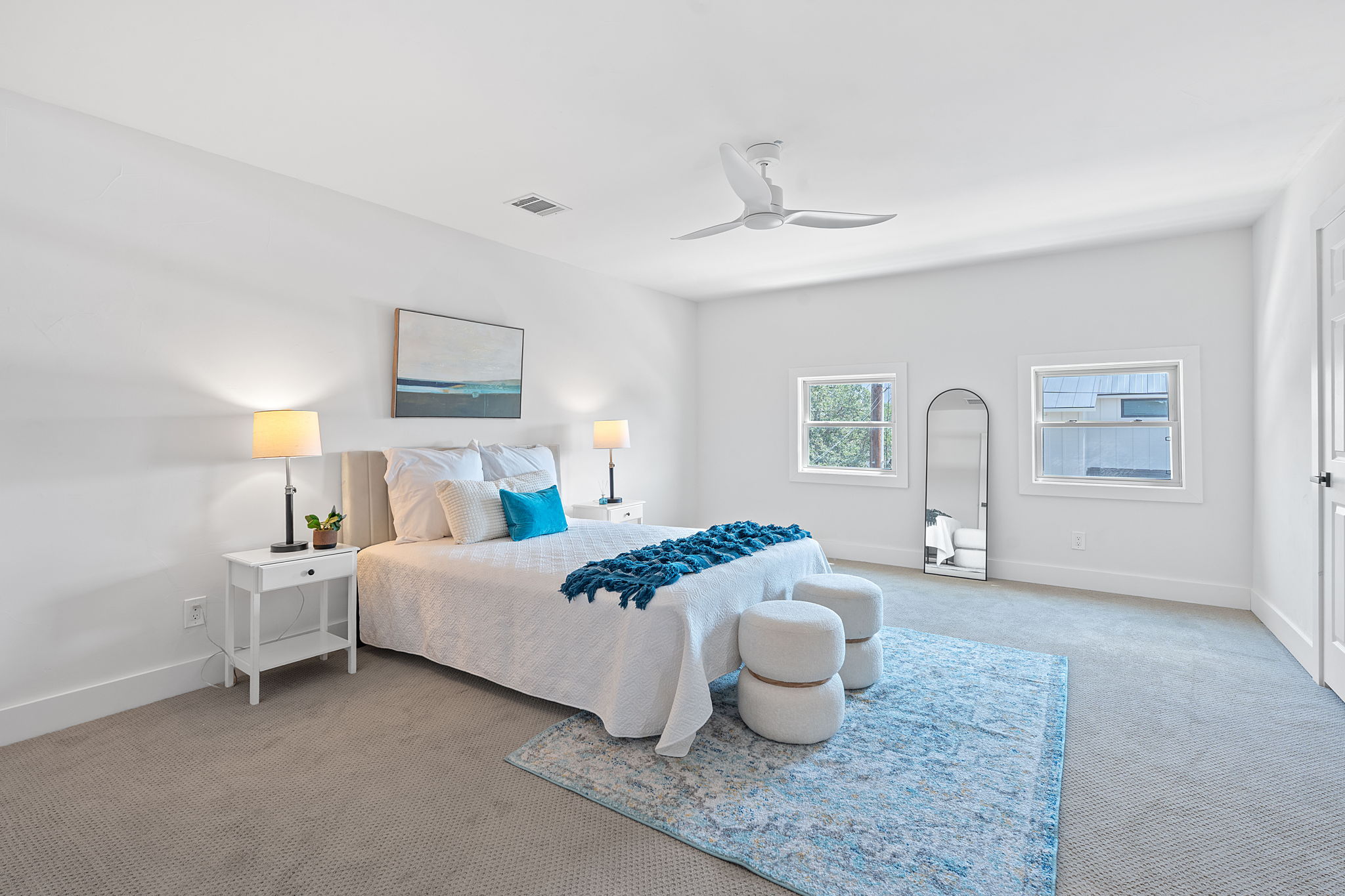 1325 Likeness Road Spicewood, TX 78669 - Photo 20 of 40 Bedroom featuring light carpet and ceiling fan