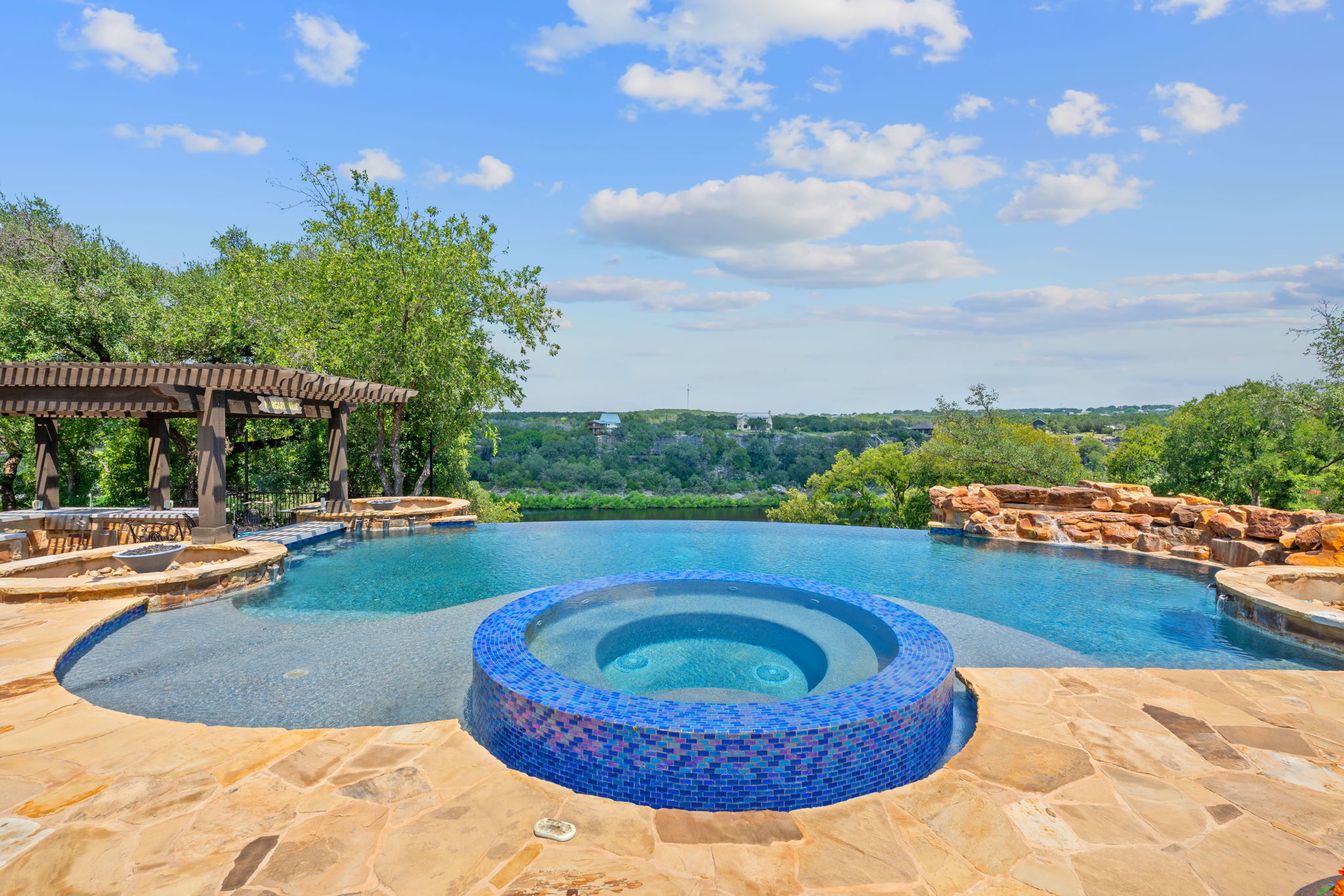 1325 Likeness Road Spicewood, TX 78669 - Photo 25 of 40 Integrated pool / hot tub with a patio area and a pergola