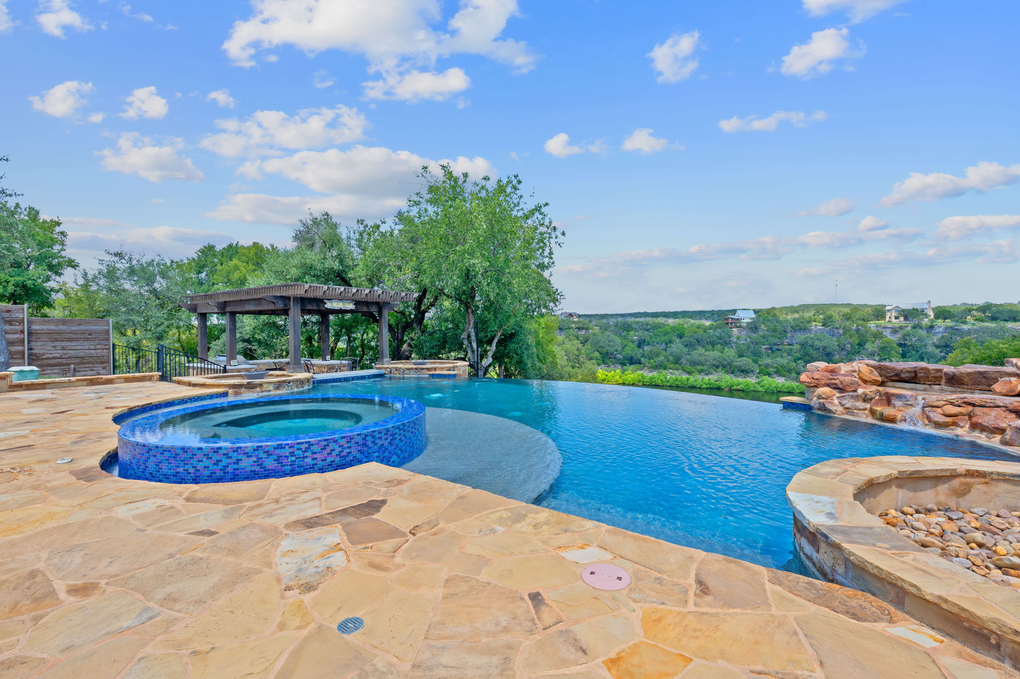 1325 Likeness Road Spicewood, TX 78669 - Photo 26 of 40 Combined pool / hot tub featuring a patio area and a pergola