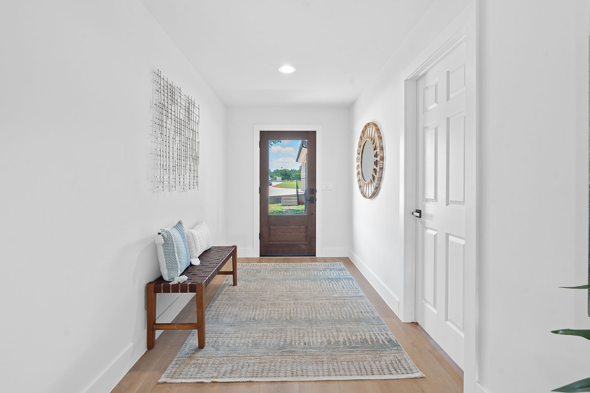 1325 Likeness Road Spicewood, TX 78669 - Photo 10 of 40 Entryway featuring light wood finished floors and recessed lighting