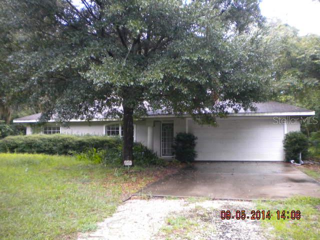 2203 Marsh Road DeLand, FL 32724 - Photo 1 of 1 a backyard of a house with lots of green space and lake view