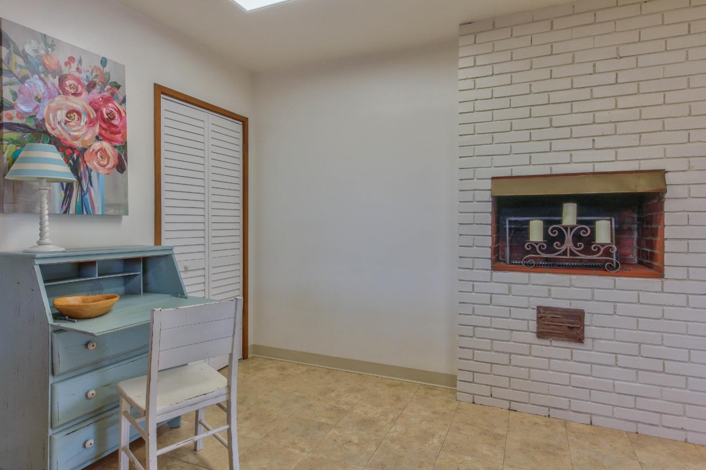 612 Sunset Drive Pacific Grove, CA 93950 - Photo 13 of 37 a living room with furniture and a fireplace
